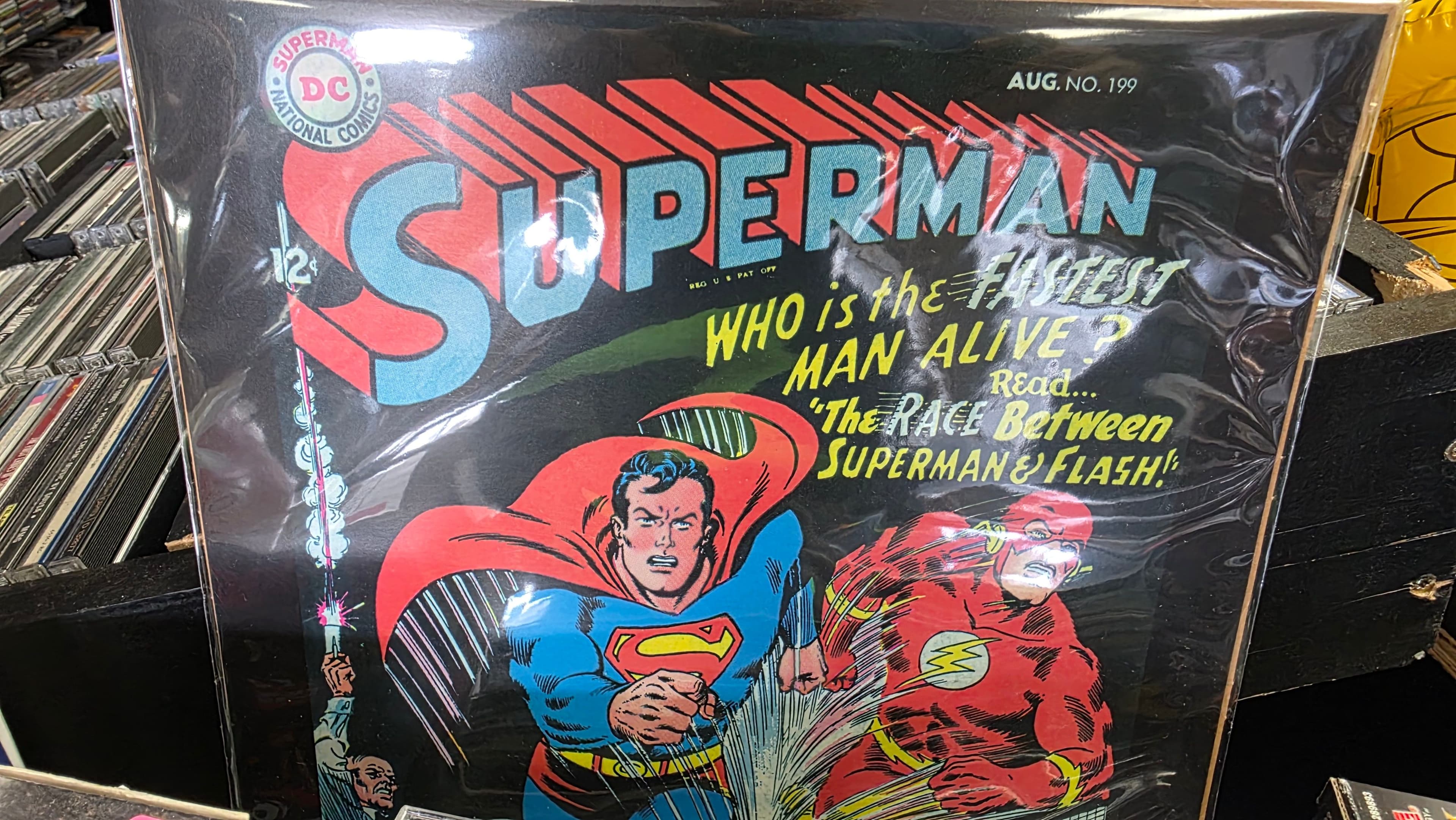 A bagged copy of Superman No. 199 standing in a comics bin.
