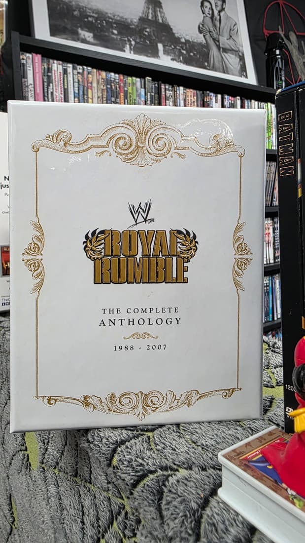 WWE Royal Rumble complete anthology box set held up against the DVD shelving
